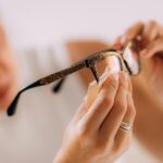 woman with ocd obsessive compulsive disorder cleaning her eyeglasses 1048944 26158244